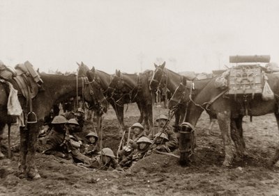 Cavalrymen resting in a shell hole by English Photographer